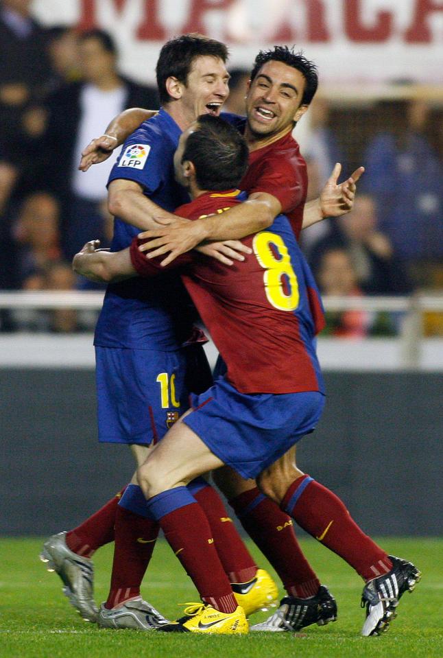 Andres Iniesta with Xavi and Lionel Messi — two of his superstars team-mates