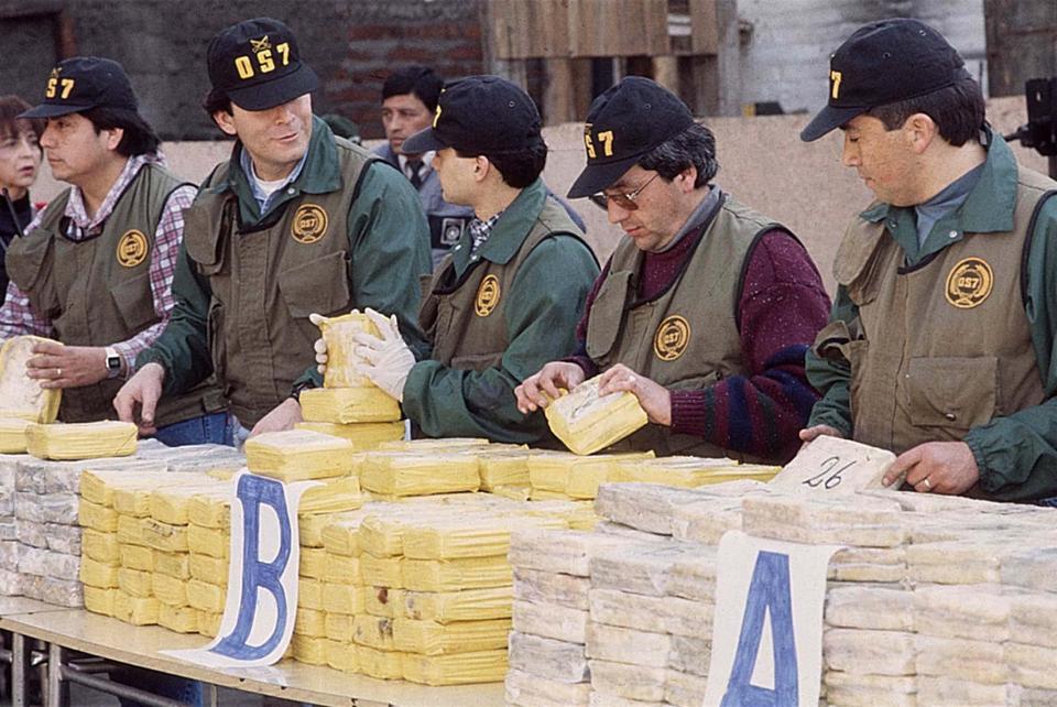  Members of the Chilean Anti-narcotics unit OS7 inspect parts of a shipment of 487 kilos of cocaine, found on board of a ship in Valparaiso
