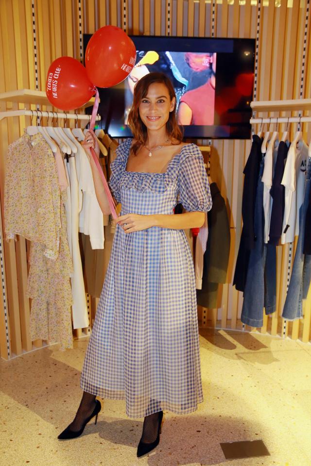 the model stepped out in a quirky number for the German fashion launch – as she wore a Dorothy-inspired gingham dress
