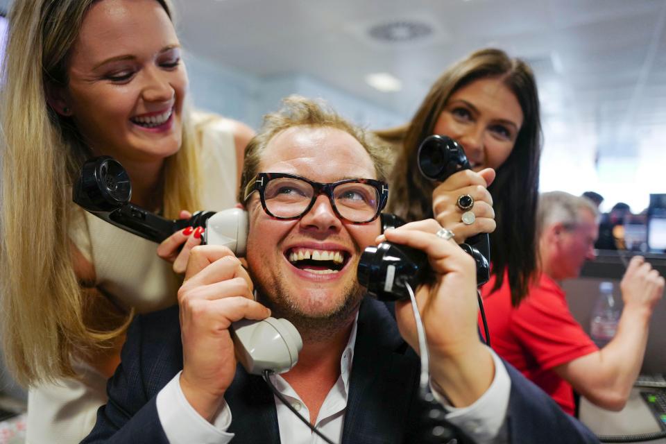  Alan Carr tried to answer four phones at once in his enthusiasm