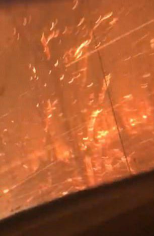  In the clip, the night sky can be seen lit in a toxic orange glow