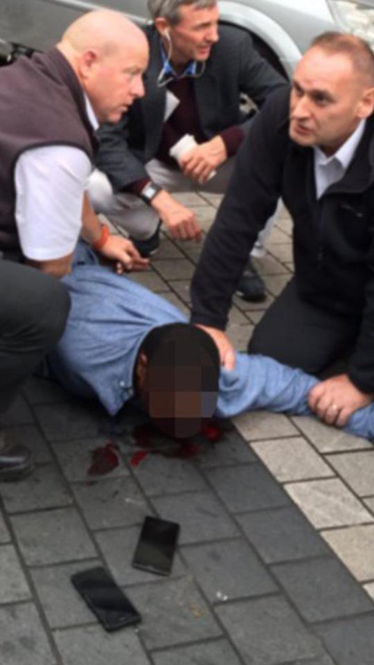  A man can be seen on the ground outside the museum