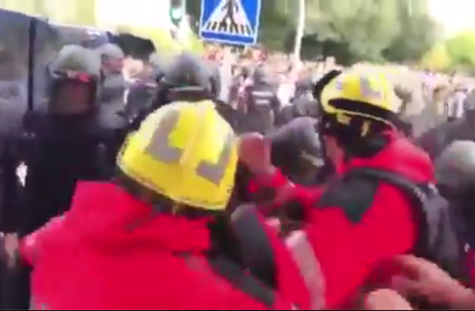 The firemen are struck repeatedly in the amateur footage 