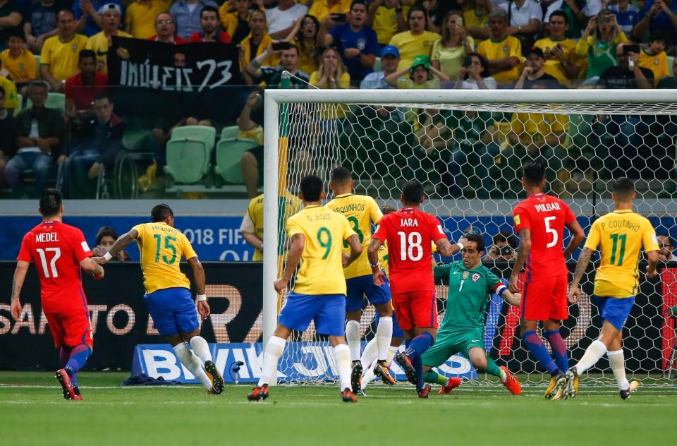 Paulinho scores for Brazil in their win that sent Chile crashing out