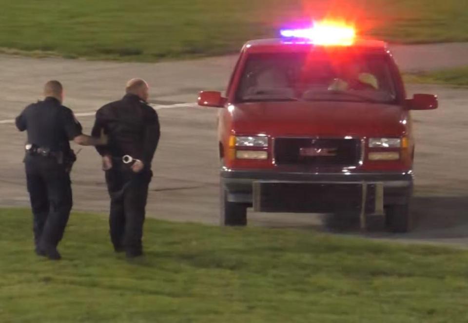 The police officer then took Shawn Cullen to the police car after handcuffing him