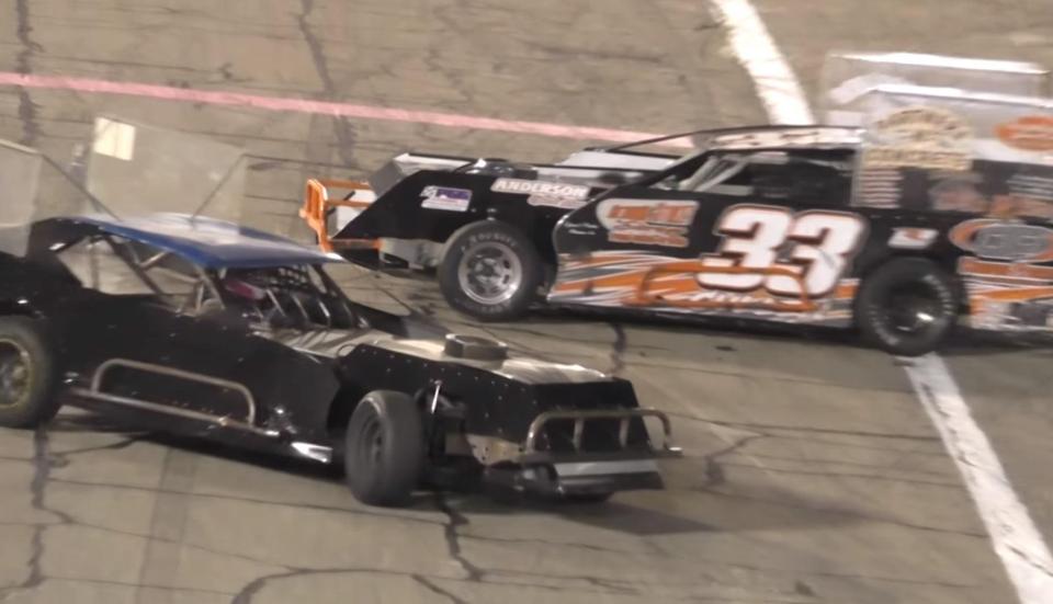 The drivers appear to argue over who caused the crash in the first place