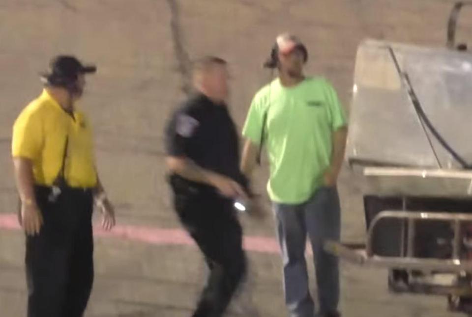 The police officer appeared from the outside of the racecourse with the drivers appearing to fight