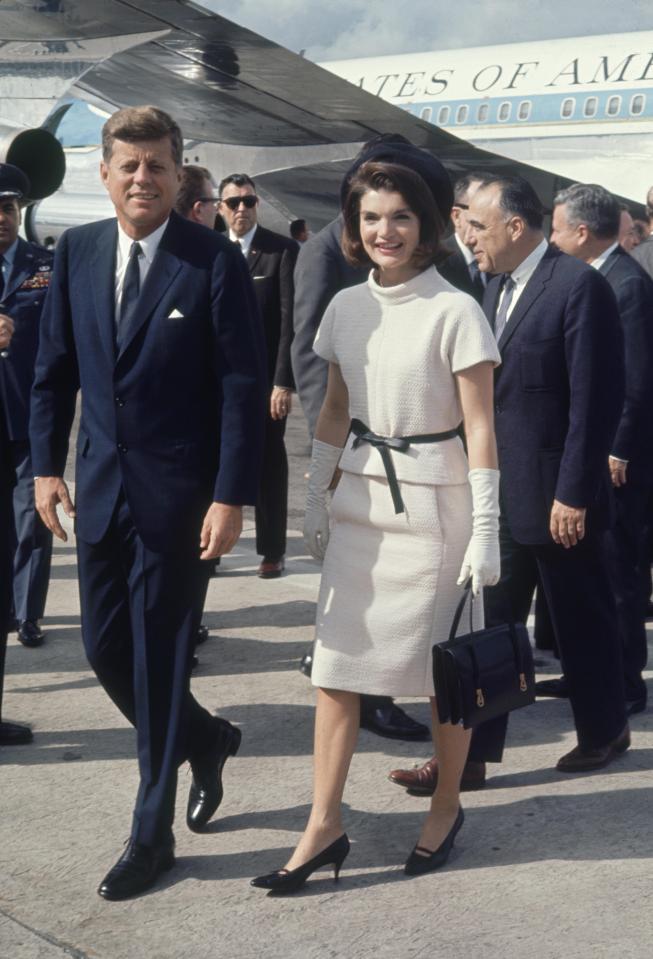 JFK and his wife Jackie pictured arriving in Texas the day before he was assassinated 