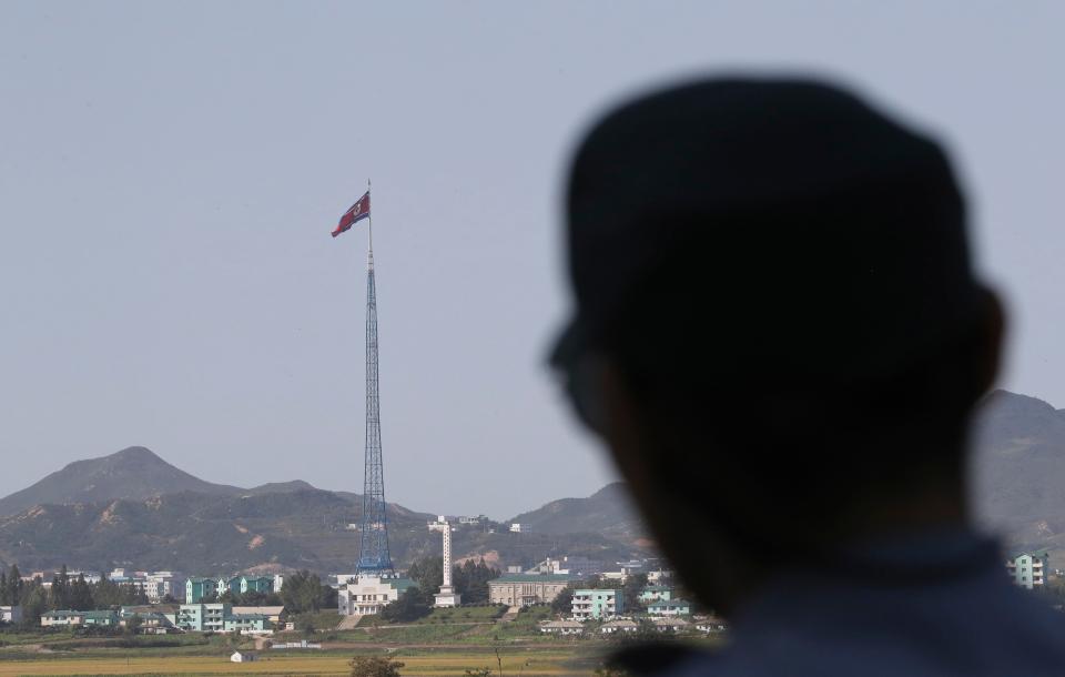  A North Korean flag flutters in the wind near the demilitarised zone which has separated the two Koreas since the Korean War