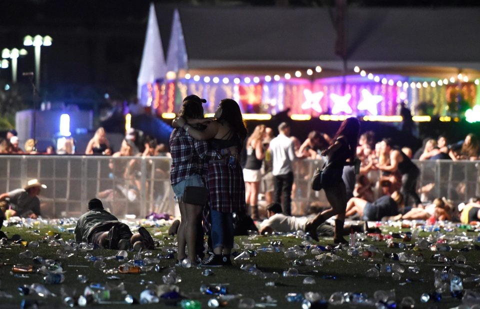 Two people hold each other as the terror unfolded on Sunday night in Las Vegas