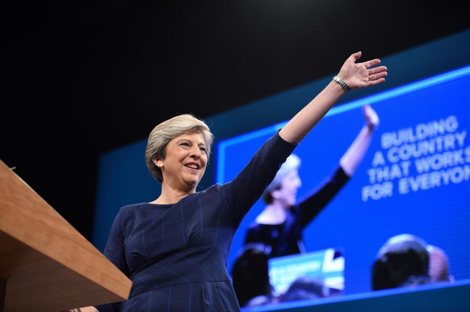  Theresa May on stage delivering her Tory conference speech - where she unveiled a council housing revolution