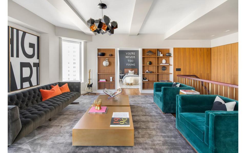 The abode is decorated with turquoise couches 