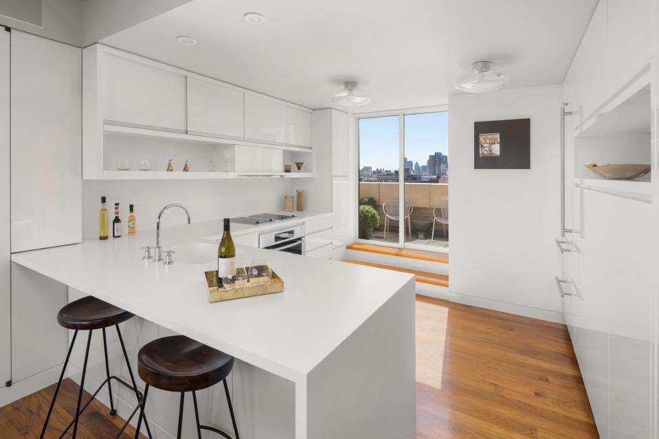 Keiths kitchen features an all-white decor