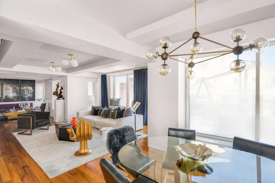 Keith bought in some trendy decor for the pad, including a gold hand chair 