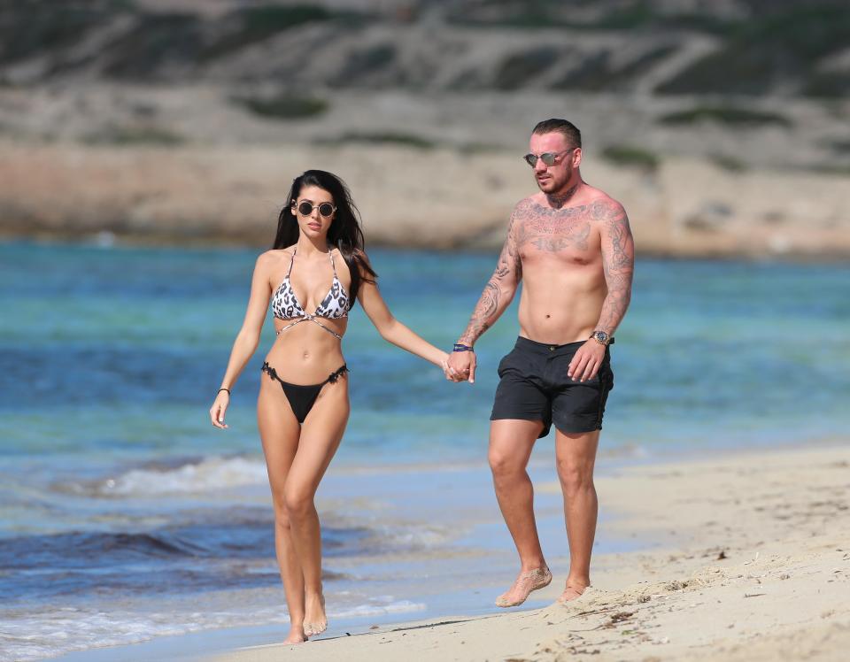  They were spotted holding hands as they walked along the beach