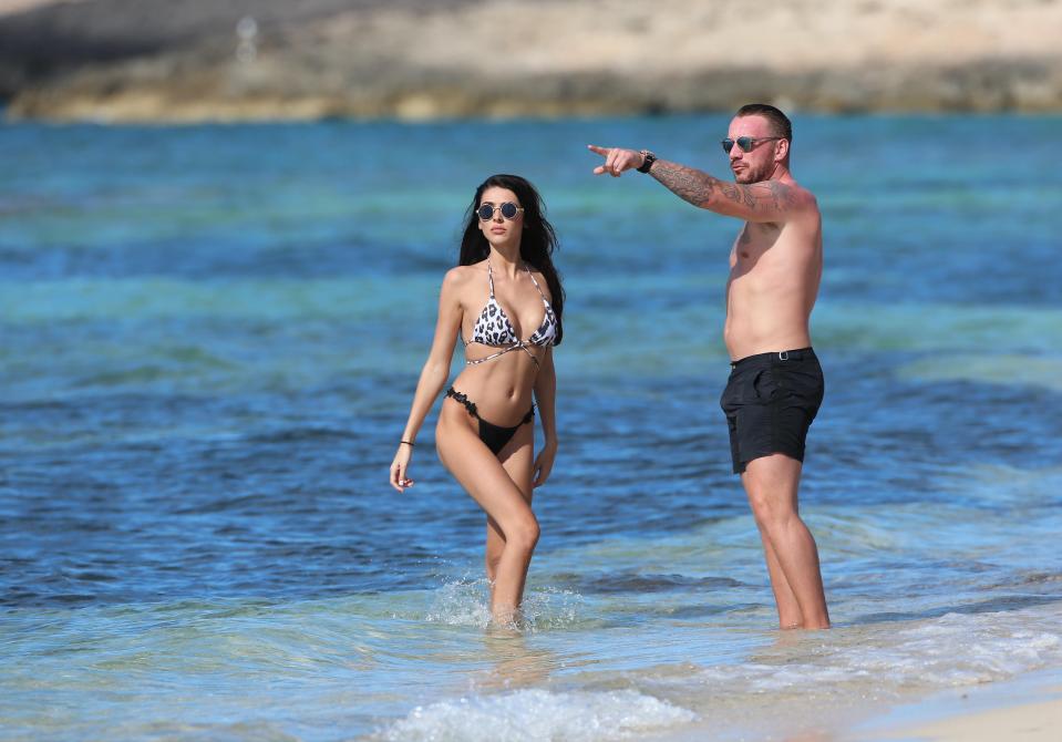  The couple were spotted splahing about in the sea together