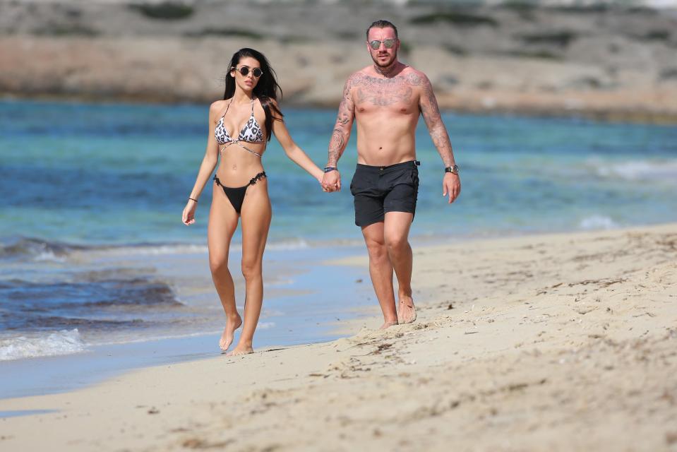  They looked happier than ever as they strolled along the sand together