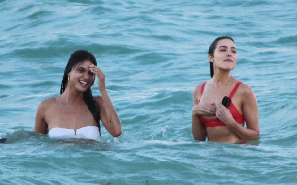  Victoria's Secret star Shanina grinned as she larked around in the water