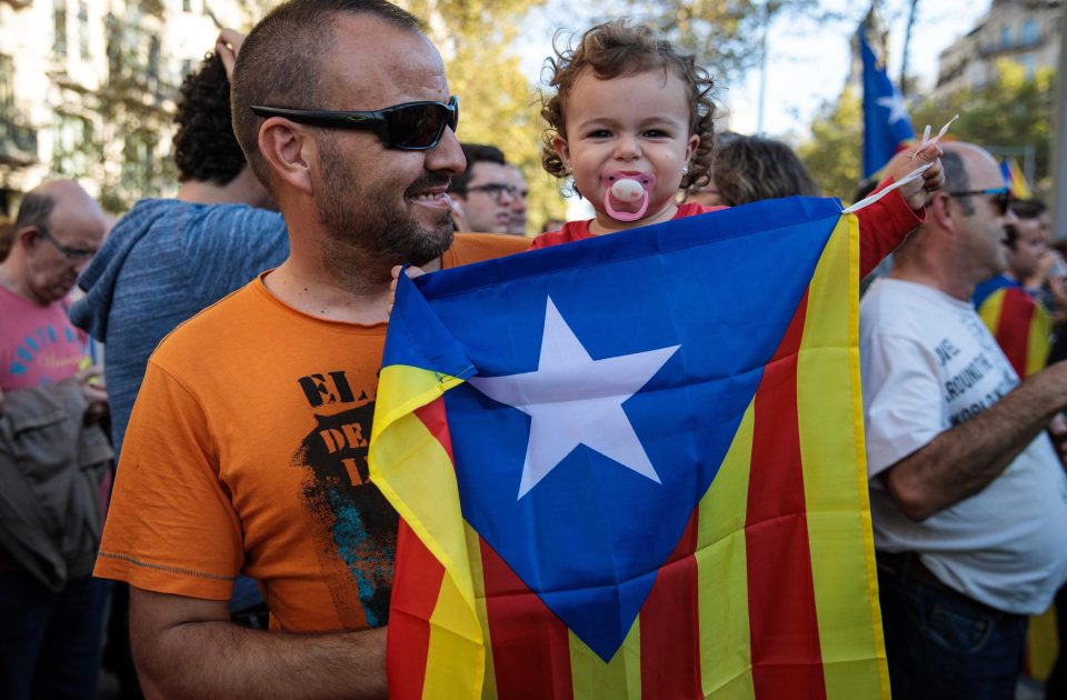  A young pro-independence demonstrator holding a flag