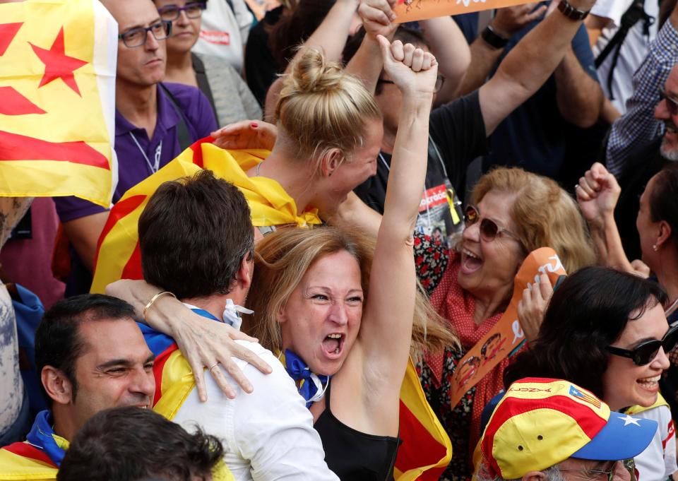 People were seen celebrating in Barcelona after the Catalan parliament declared independence from Spain