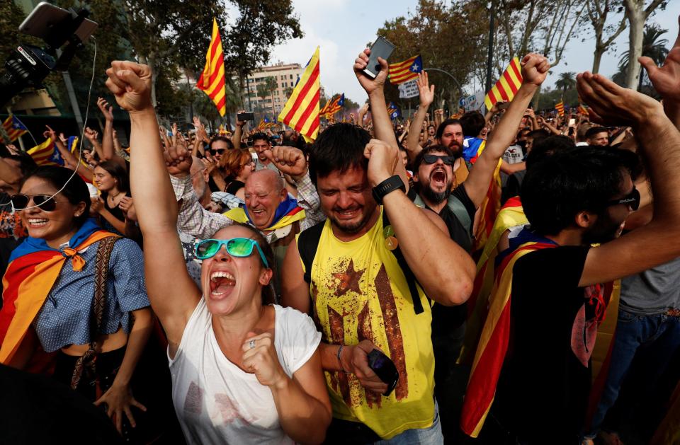 The crowds clapped and shouted 'independence' in Catalan before singing the regional hymn, many raising their fists