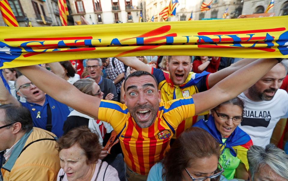  A Barcelona fan is pictured among the crowds celebrating in the Catalan capital