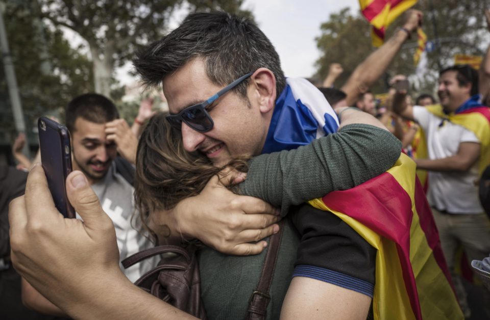 Catalan independence supporters massed outside the Parliament of Catalonia react with joy just at the news that the Catalan Parliament votes to declare independence from Spain
