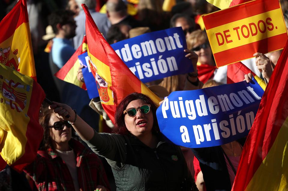 ro-unity demonstrators with banners calling for the imprisonment of sacked Catalan President Carles Puigdemont, gather in Madrid