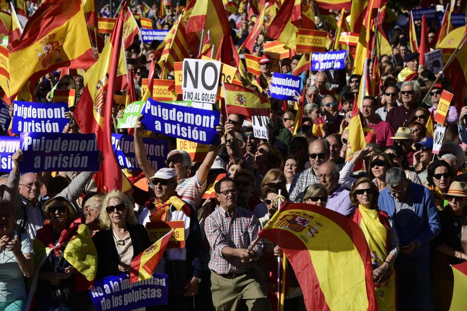  Protesters called for Mr Puidgemont to be imprisoned at a pro-unity demo in Madrid that descended into violence