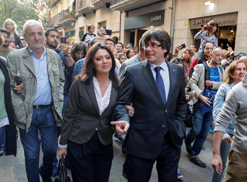  Mr Puidgemont and his wife are cheered in Barcelona on Saturday, 24 hours after the regional parliament declared independence