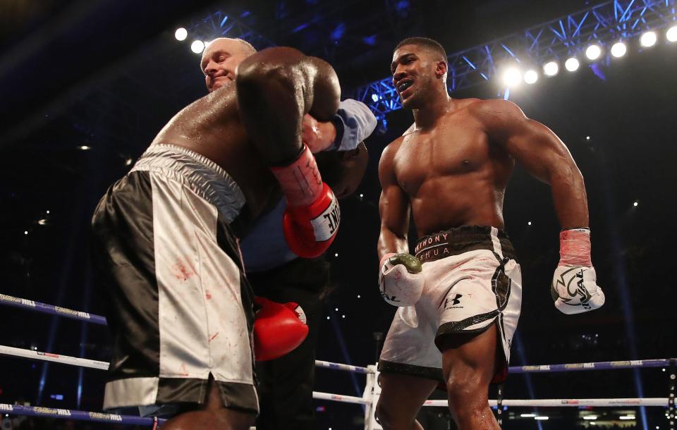  The ref gets in to break up the fight in Anthony Joshua's favour