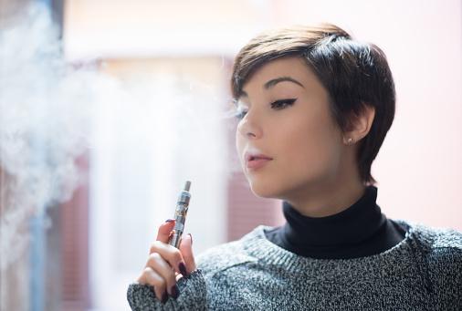 Teenagers who try vaping are more likely to become regular smokers, research suggests