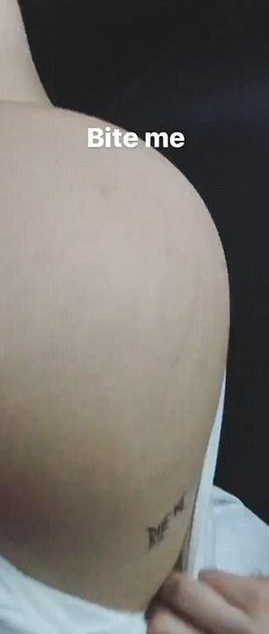  Bella showed off her 'bite me' tattoo last month
