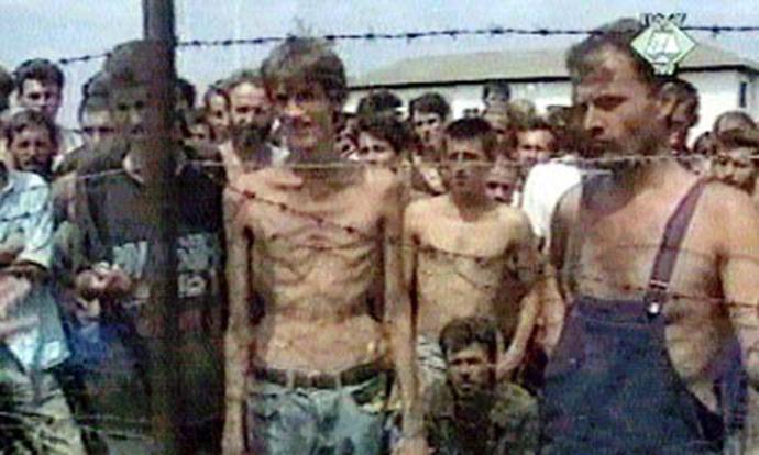  Alic is seen emaciated behind barbed wire of a concentration camp in northern Bosnia Herzegovina
