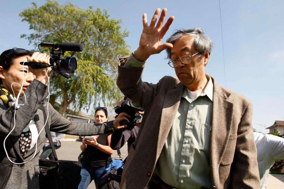  Dorian Satoshi Nakamoto, pictured surrounded by reporters outside his home in Temple City, California, in May 2014