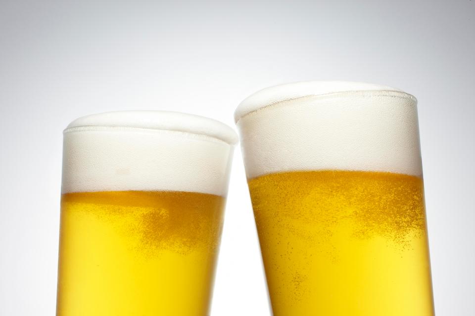 Experts urged people to limit their intake of booze, likening it to wearing suncream, in the fight against cancer
