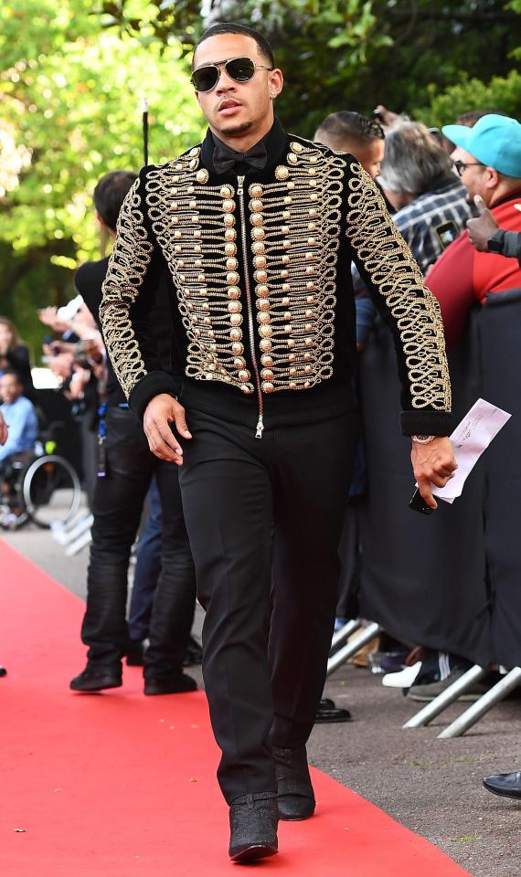  Memphis Depay was spotted out and about wearing a Balmain military jacket