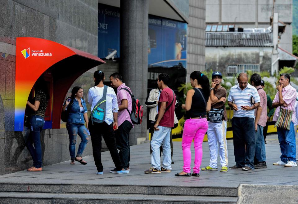  Queues for cashpoints and other essential services in the capital are now common