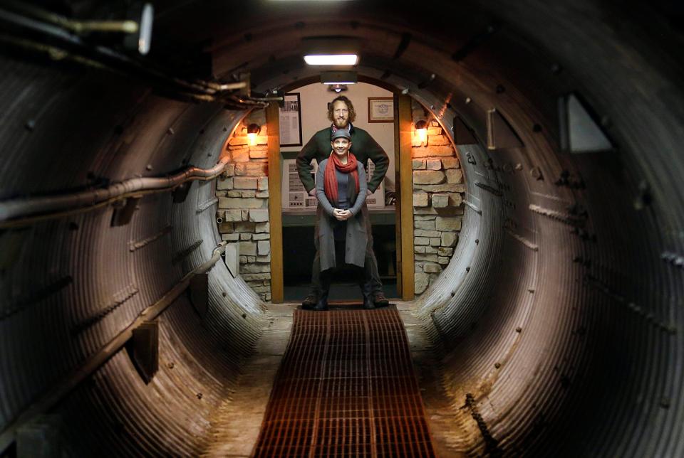 Mathew Fulkerson and his wife Leigh Ann pose at their Subterra Airbnb located in a former underground missile silo base in Kansas