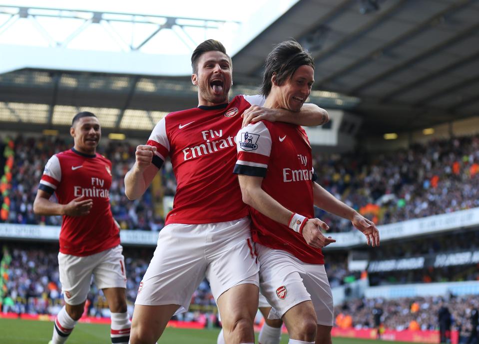 Tomas Rosicky celebrates scoring at White Hart Lane in the North London derby