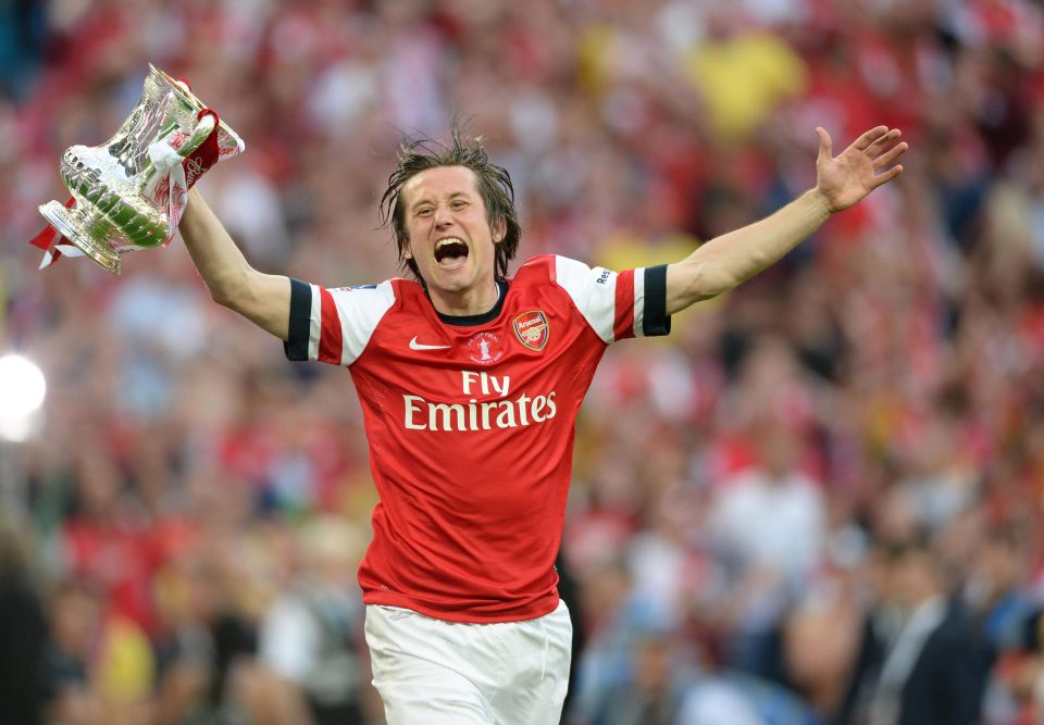 Tomas Rosicky celebrates with the FA Cup in 2014 after Arsenal won their first trophy in nine years 