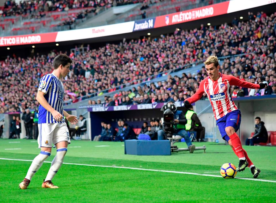  Antoine Griezmann takes on midfielder Igor Zubeldia