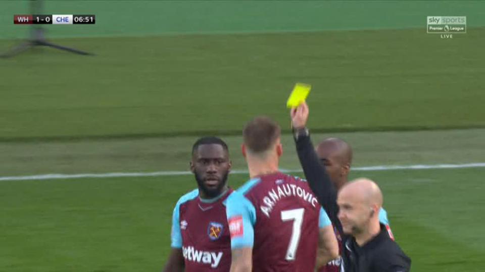  Referee Anthony Taylor shows Arnautovic the yellow card