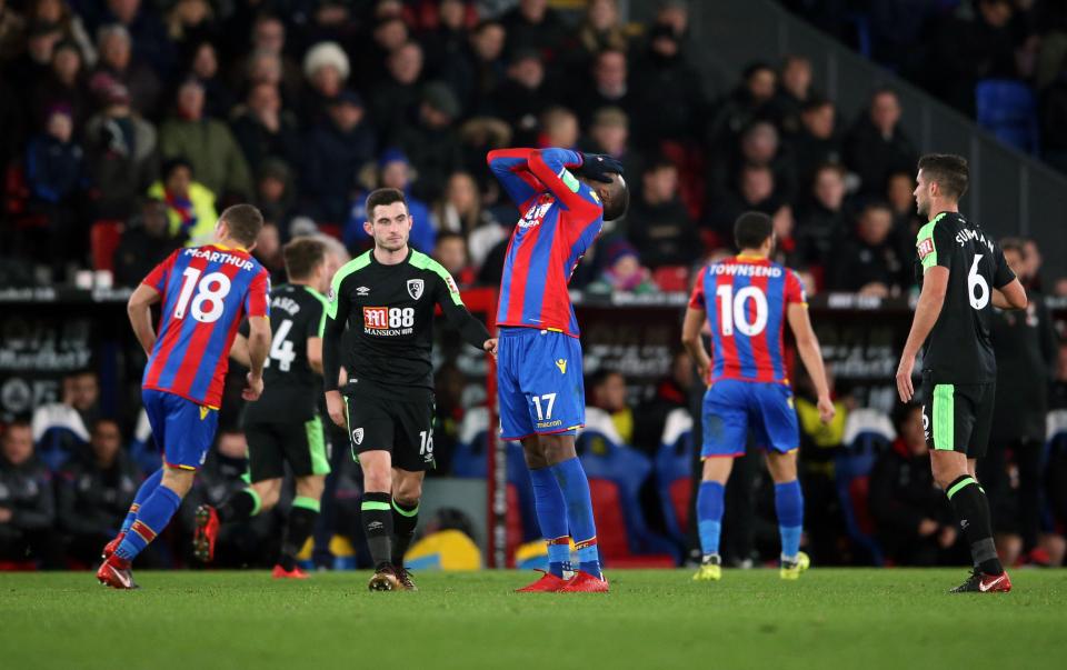 Christian Benteke holds his head in his hands after missing his last-minute spot kick for Palace