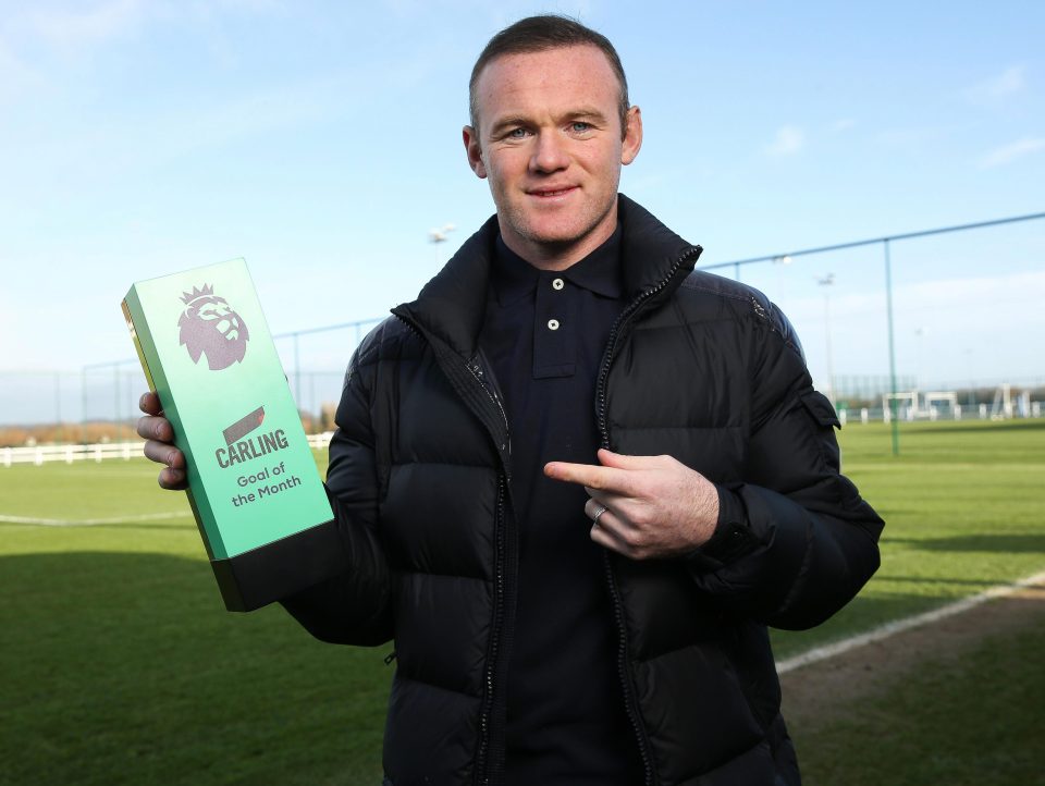Wayne Rooney with his Goal of the Month award for November