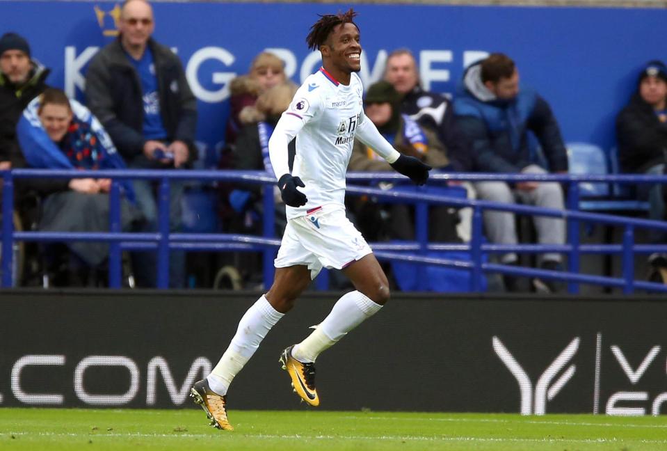 Wilfried Zaha wheels away after giving Crystal Palace a 2-0 lead