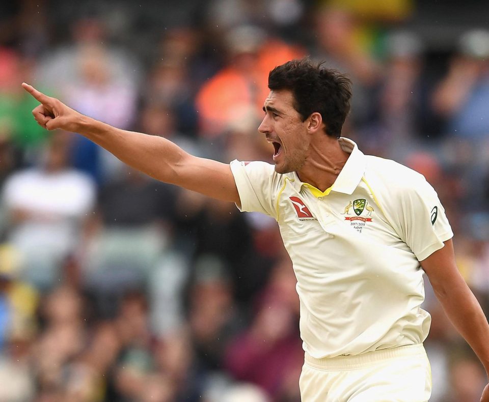 Mitchell Starc celebrates taking the key wicket of James Vince
