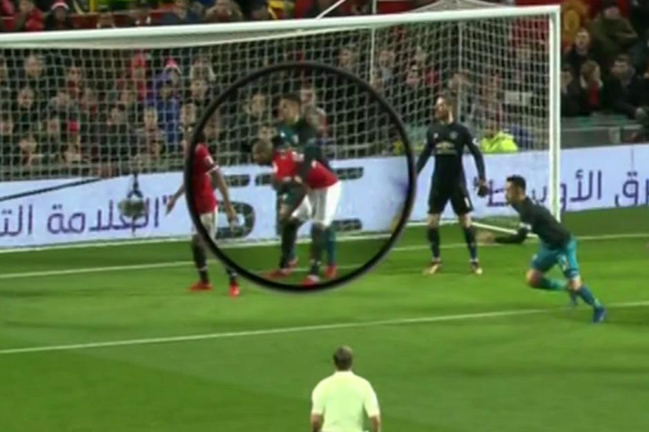 Ashley Young and Dusan Tadic clash at Old Trafford