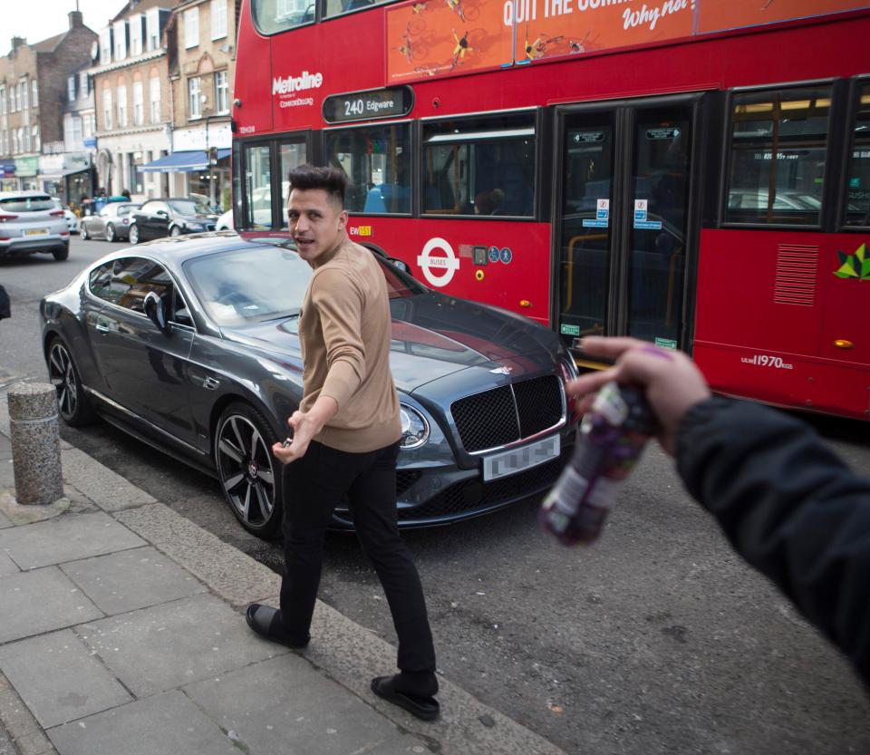 Wantaway Arsenal ace Alexis Sanchez jumped back in his car following his Wednesday afternoon haircut