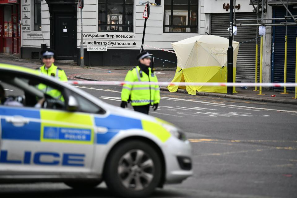 Police at the scene of a murder in Tulse Hill - one of four across the capital last night